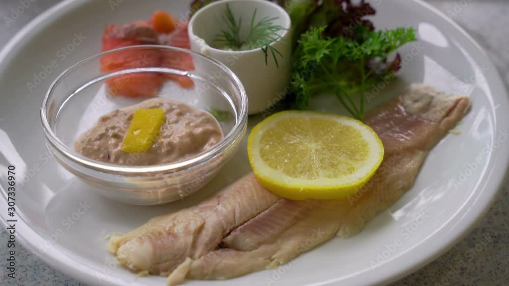 Trout steak with vegetable on plate Trout steak with vegetable on plate