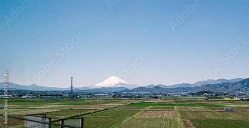 Japanese countryside with rice field and fuji mountain in background , View from high speed train