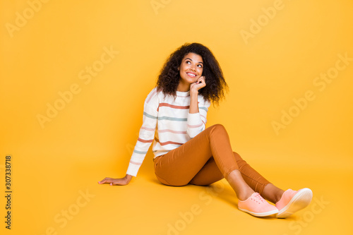Full length body photo of attractive charming friendly kind carefree girl enjoying spring winter vacation looking to the top isolated bright color background