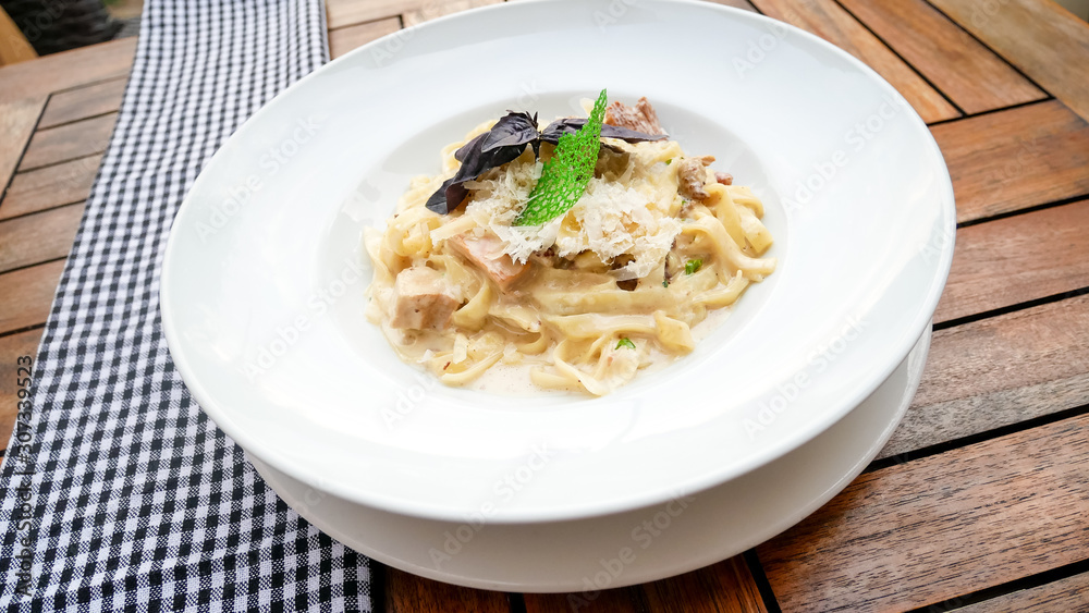 Pasta dish on a restaurant table Pasta dish on a restaurant table