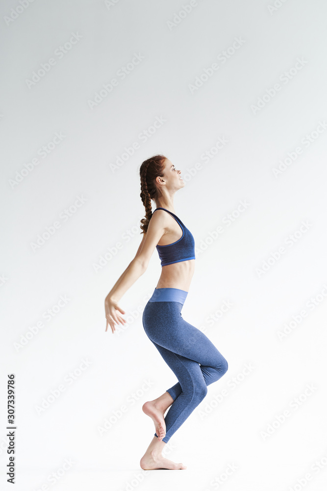 young woman doing yoga exercise