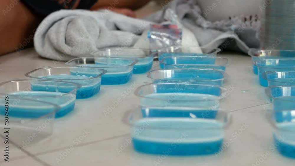 Homemade soap making process - after pouring hot liquid soap into molds, spraying a little bit of Isopropyl Alcohol 91% to break up the air bubbles to make the finished soap more smooth and beautiful Homemade soap making process - after pouring hot liquid soap into molds, spraying a little bit of Isopropyl Alcohol 91% to break up the air bubbles to make the finished soap more smooth and beautiful