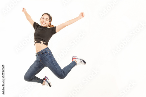 Young women exercise by jumping. Asian Female jumping. girl jumping over isolated white background. Movement speed.
