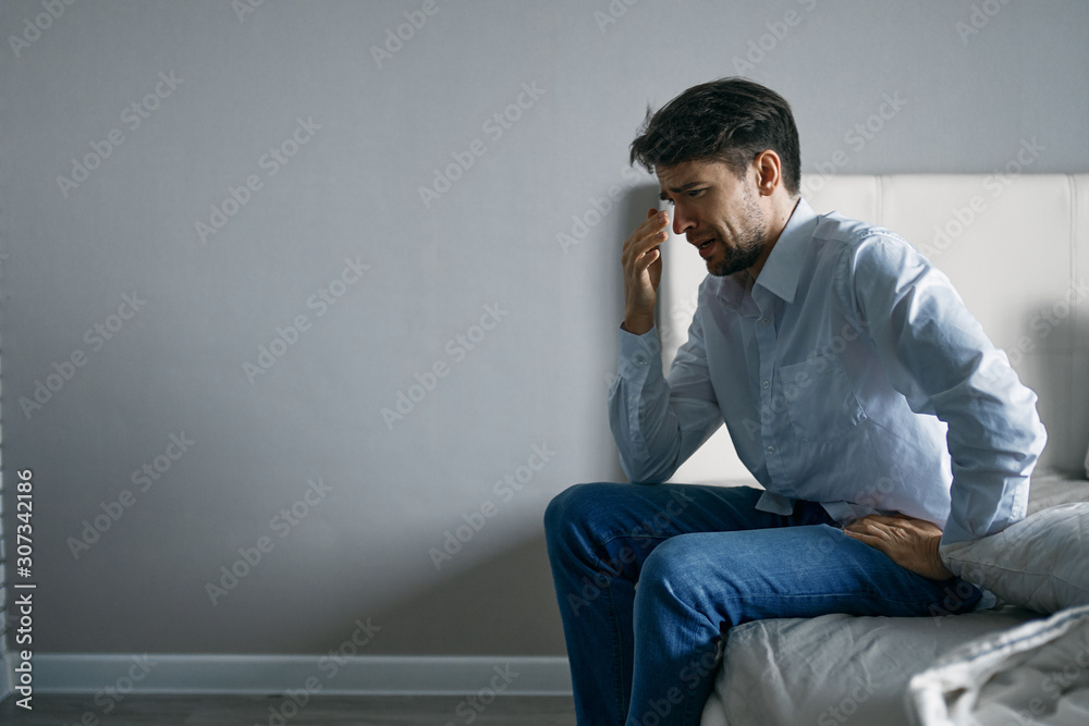 young man sitting on sofa young man sitting on sofa