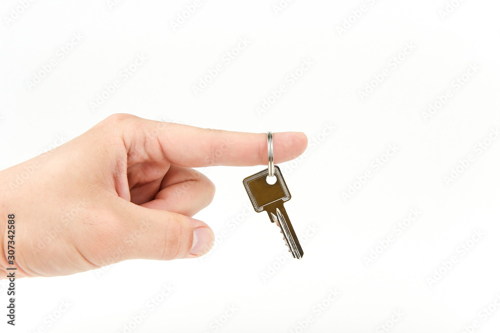 hand holding key on white background with copy space hand holding key on white background with copy space