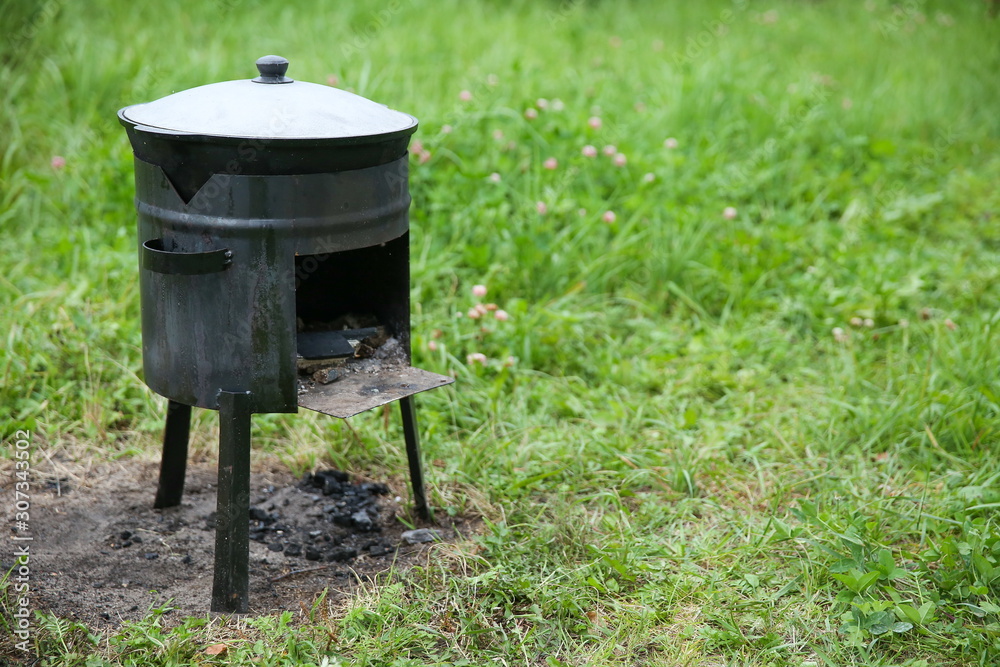 cauldron on a small portable stove cauldron on a small portable stove
