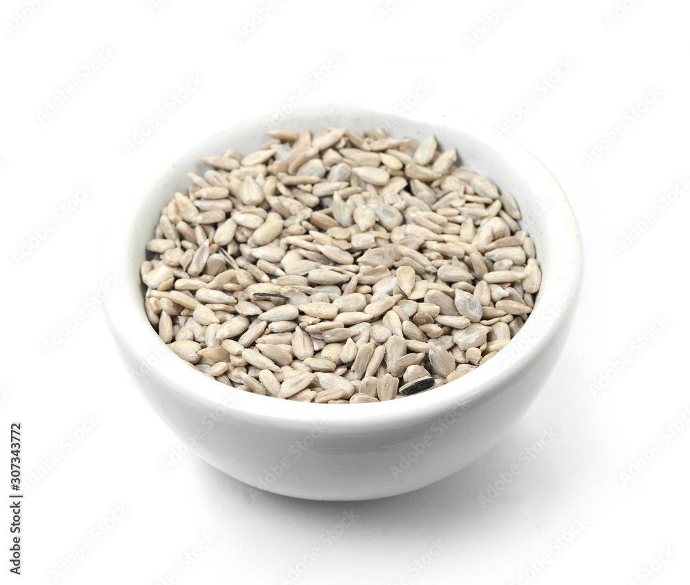 sunflower seeds in a white bowl isolated on white sunflower seeds in a white bowl isolated on white