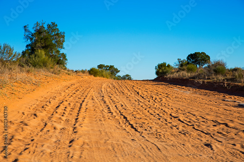 Photos Outback Australian desert road with corrugations and tyre marks.
