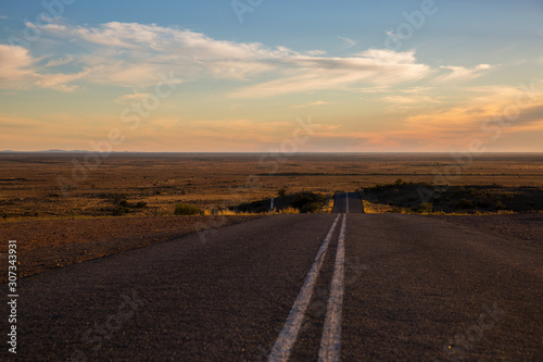 Outback highway near Silverton, New South Wales, overlooking the Mundi Mundi Plains.