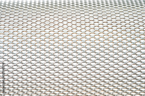 Close-up metal mesh structure with equal intervals of holes