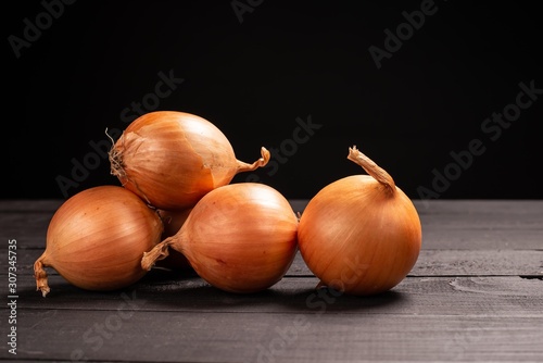 onion on black wooden background