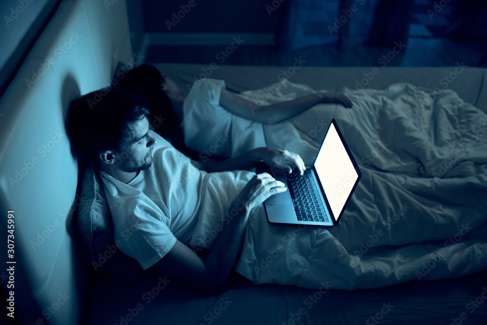 man sleeping in bed
