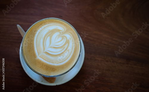 Latte coffee on wooden background
