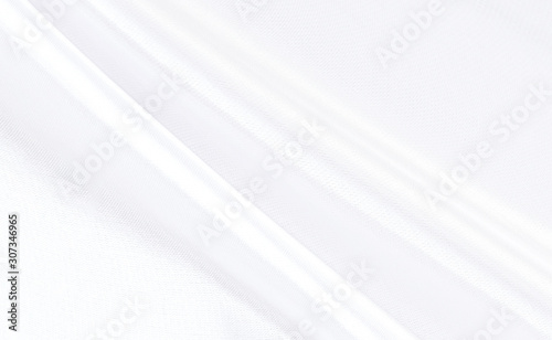 White gray satin texture that is white silver fabric silk background with beautiful soft blur pattern natural.