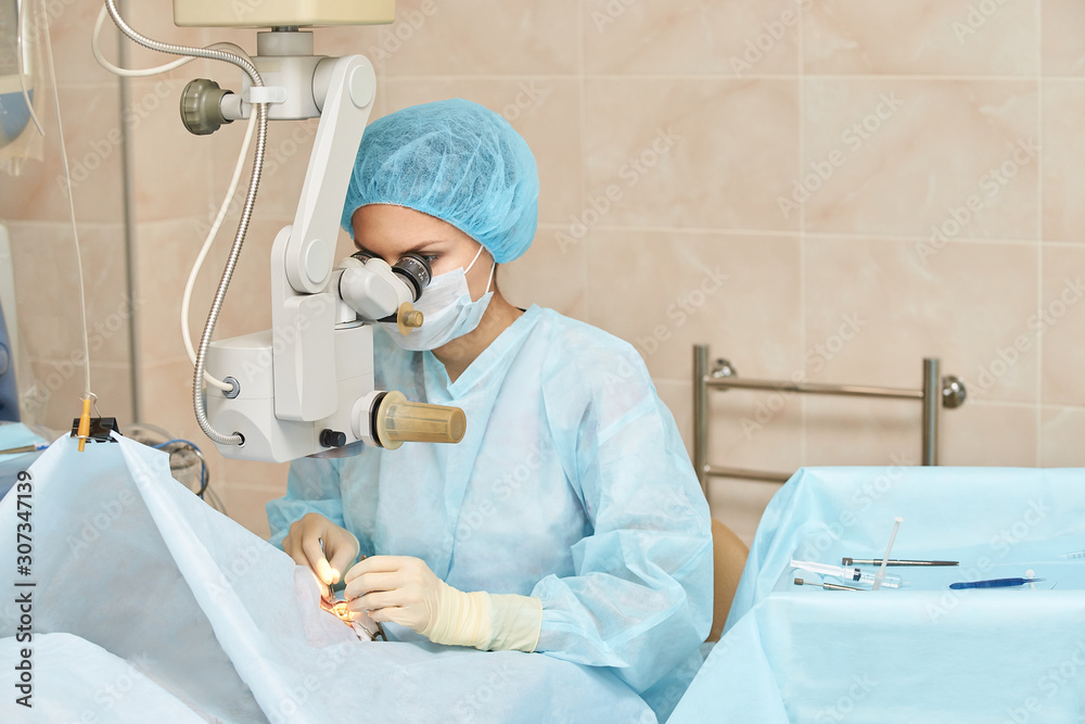 Ophthalmology laser microscope operation. Doctor in clinic. Patient eye ...