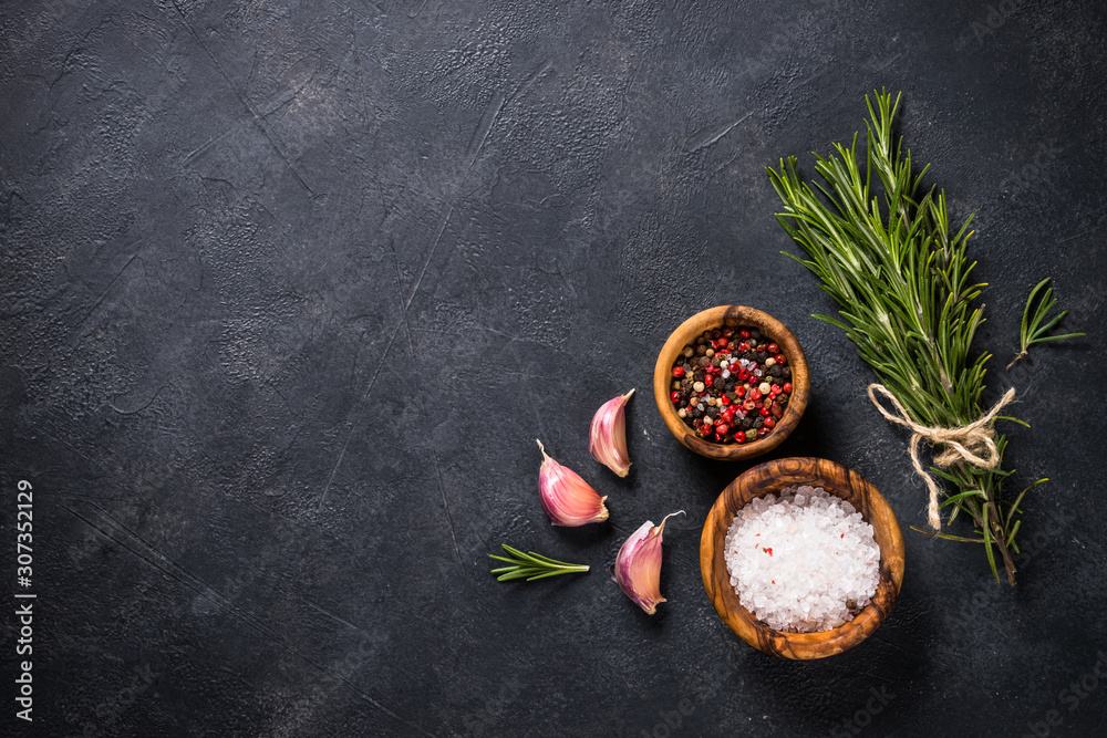 Food cooking background with herbs and spices on black. Stock Photo