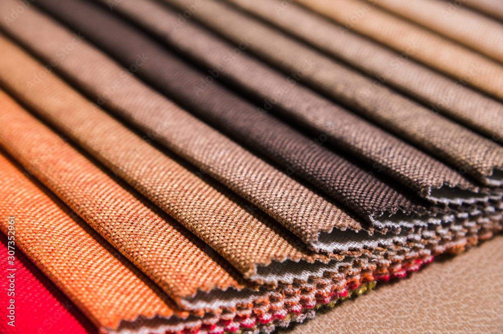 Colorful and bright fabric samples of furniture and clothing upholstery. Close-up of a palette of textile abstract stripes of different colors Colorful and bright fabric samples of furniture and clothing upholstery. Close-up of a palette of textile abstract stripes of different colors