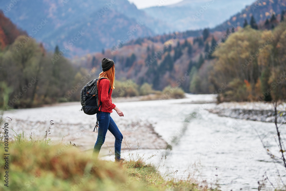 woman hiking in mountains woman hiking in mountains