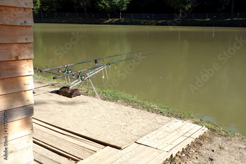 Fishing rods on the shore of a pond