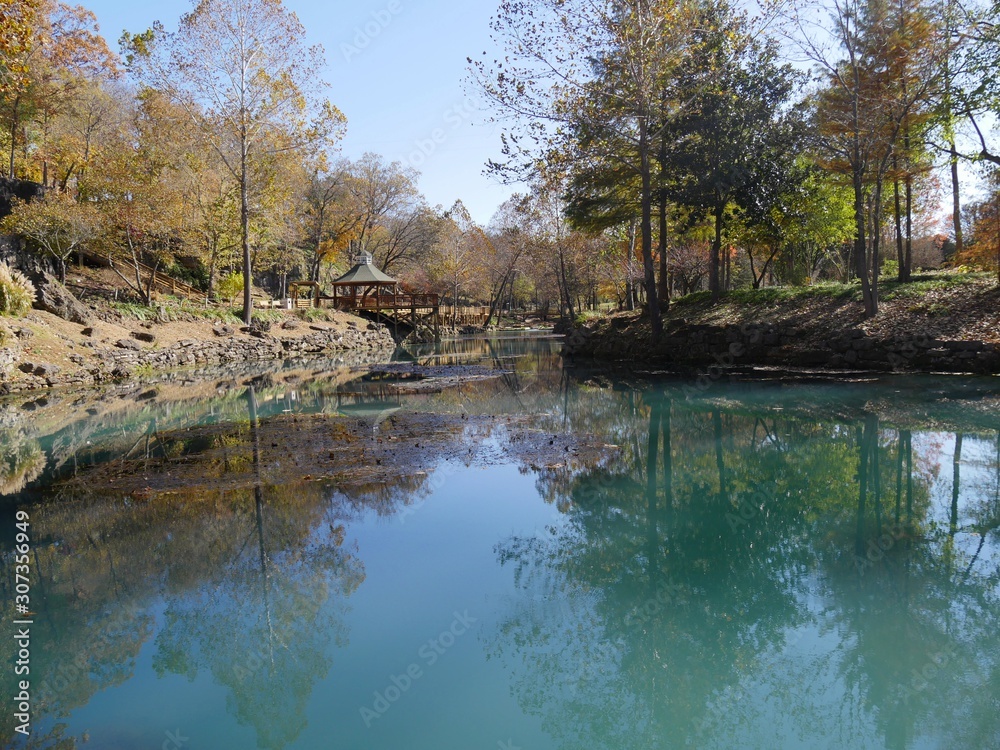 Scenic view of blue waters at a spring in autumn
