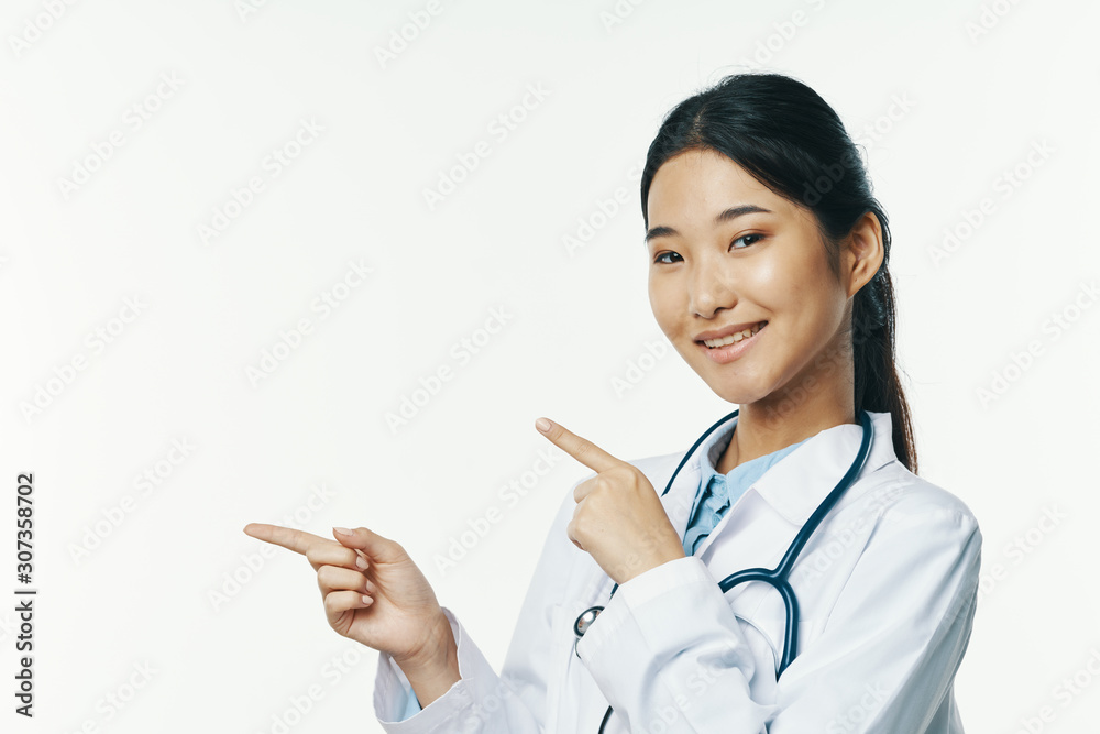 young doctor with stethoscope isolated on white young doctor with stethoscope isolated on white