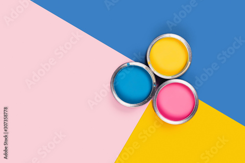 Three-colored background with paint jars.