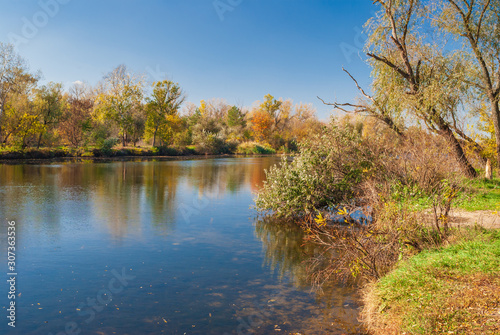 Autumnal landscape with small Ukrainian river Oril at sunny day