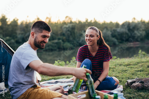 friends having fun camping outdoor © cherryandbees