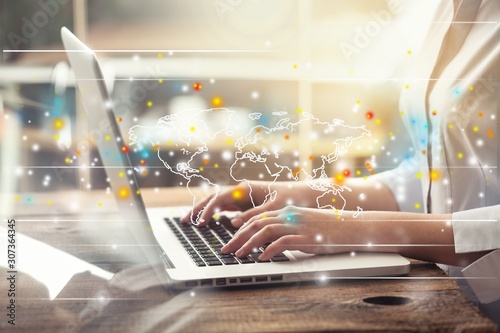 Man holding a credit card and typing. On-line shopping on the internet using a laptop