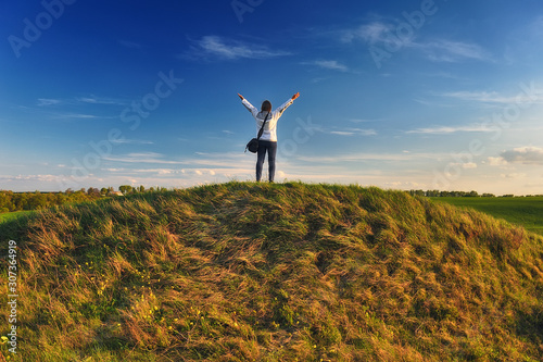 tourist on the hill. a traveler alone with nature. tourist enjoys the view