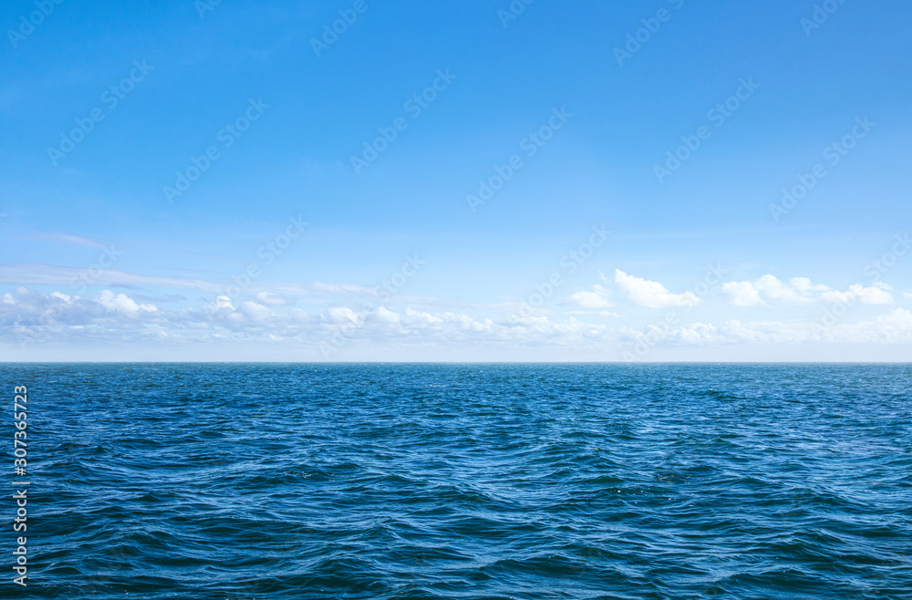 Obraz premium blue sea and blue sky water waves