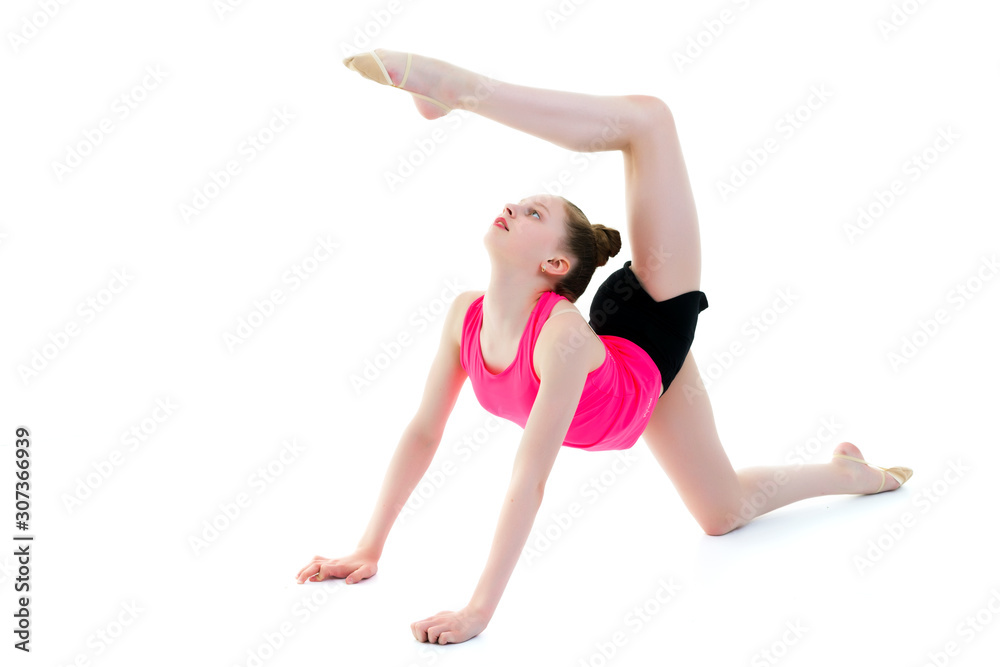 The gymnast perform an acrobatic element on the floor. The gymnast perform an acrobatic element on the floor.