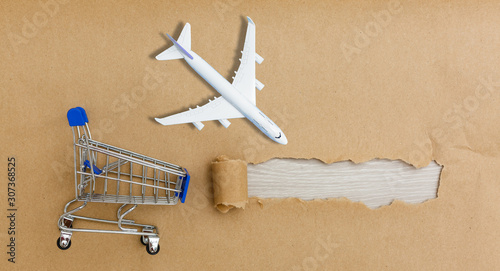 Torn paper box on white plane photo
