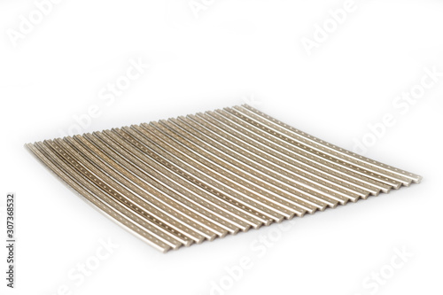 Frets of the guitar neck metal, workpieces for manufacturing, shot large on a white background