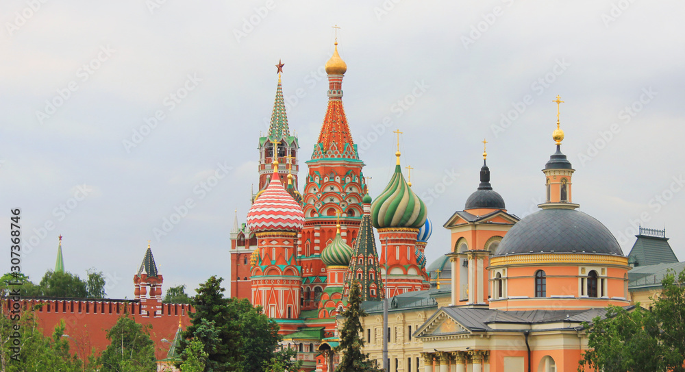 Moscow old town historic view with Kremlin and Saint Basil's Cathedral in Moscow, Russia. Architecture perspective view historical city buildings on the Red Square 