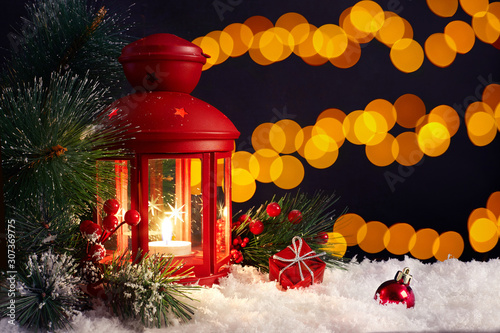 Christmas decoration with candle and snow.