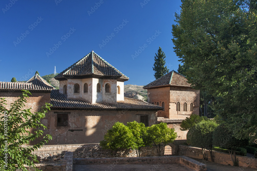 Alhambra fortress among green trees Alhambra fortress among green trees