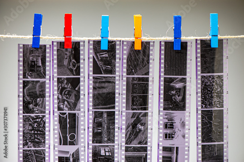 Negative Black and White Film is Dried in the Darkroom. Vintage Aged Analog  Exposure Retro Memory Dry Camera