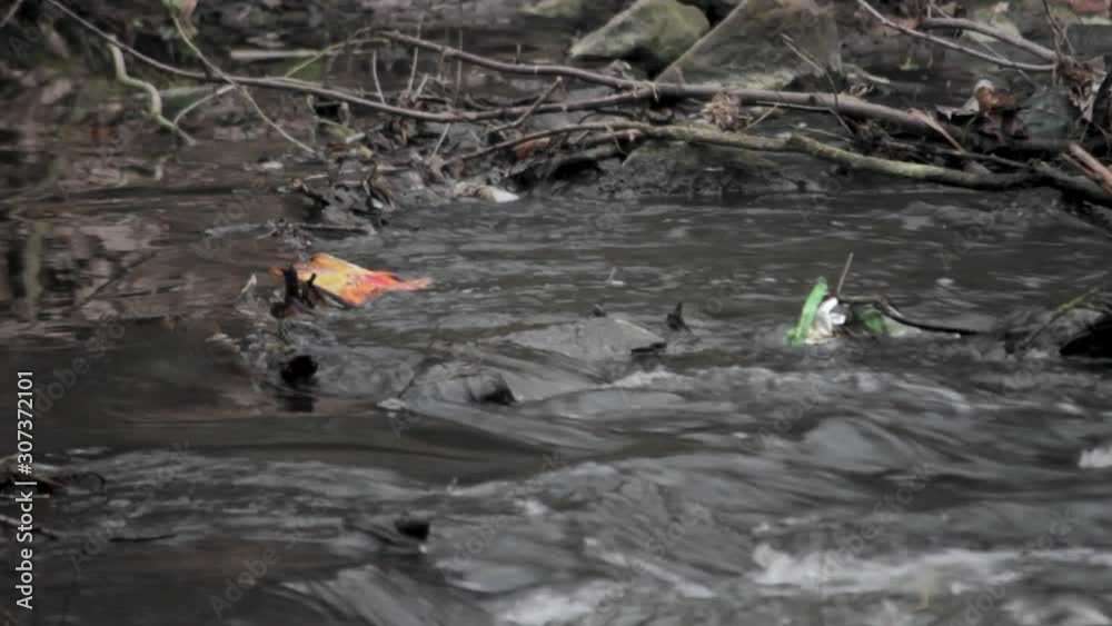 Polluted river in mud with waste and dirty chemical in water Polluted river in mud with waste and dirty chemical in water