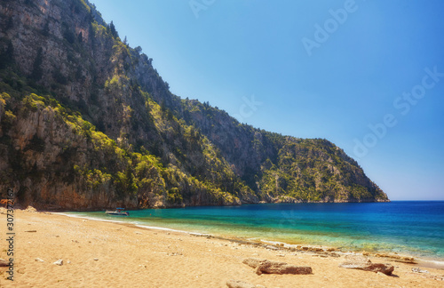 Summer butterfly valley sea beach view and cruise boat Oludeniz