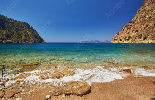 Summer butterfly valley sea beach view and cruise boat Oludeniz