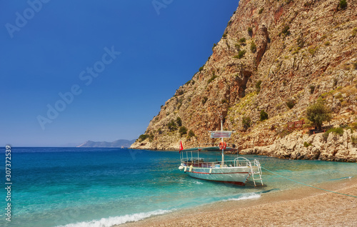 Fototapeta Naklejka Na Ścianę i Meble -  Tourists visit famous Butterfly Valley beach