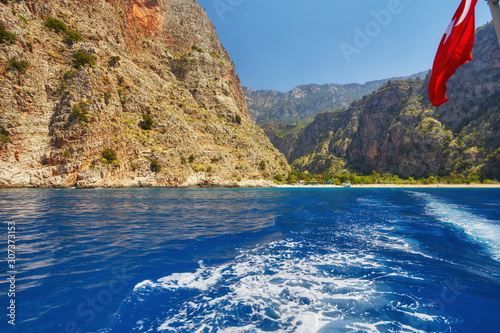 Fototapeta Naklejka Na Ścianę i Meble -  Summer butterfly valley sea beach view and cruise boat Oludeniz