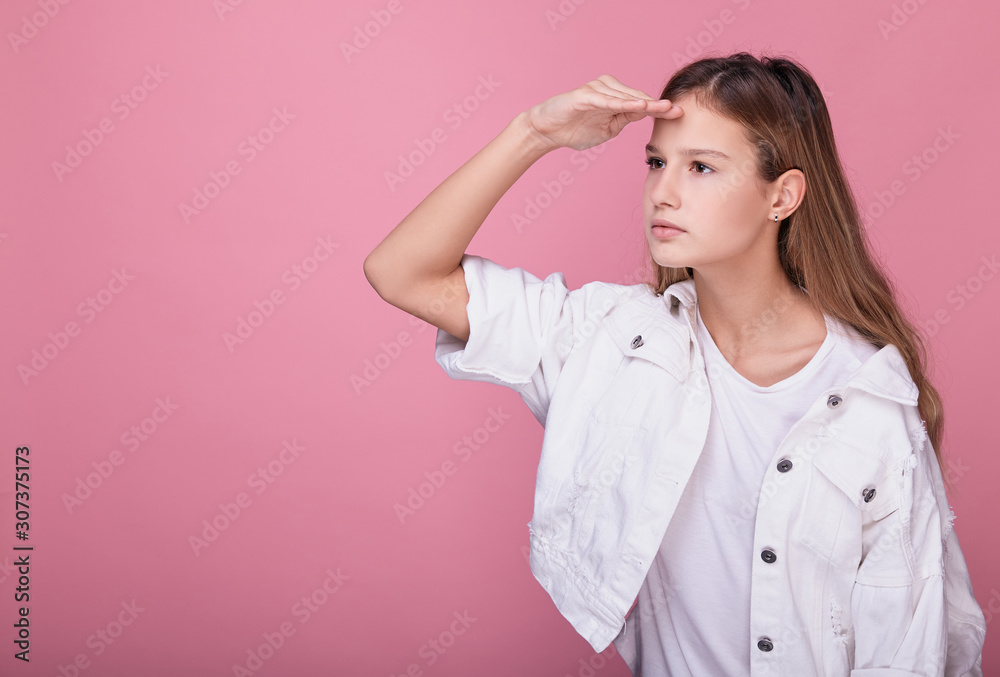 Beautiful girl carefully and seriously looks away. Beautiful girl carefully and seriously looks away.