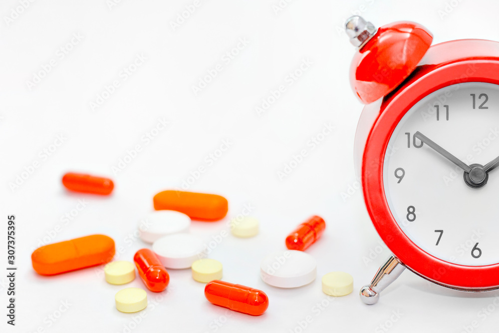 Alarm Clock With Medicament: pills, capsule, tablets, drug of painkillers,  vitamin. Time of pill. Health care, pharmacy, medicine concept Stock-Foto |  Adobe Stock