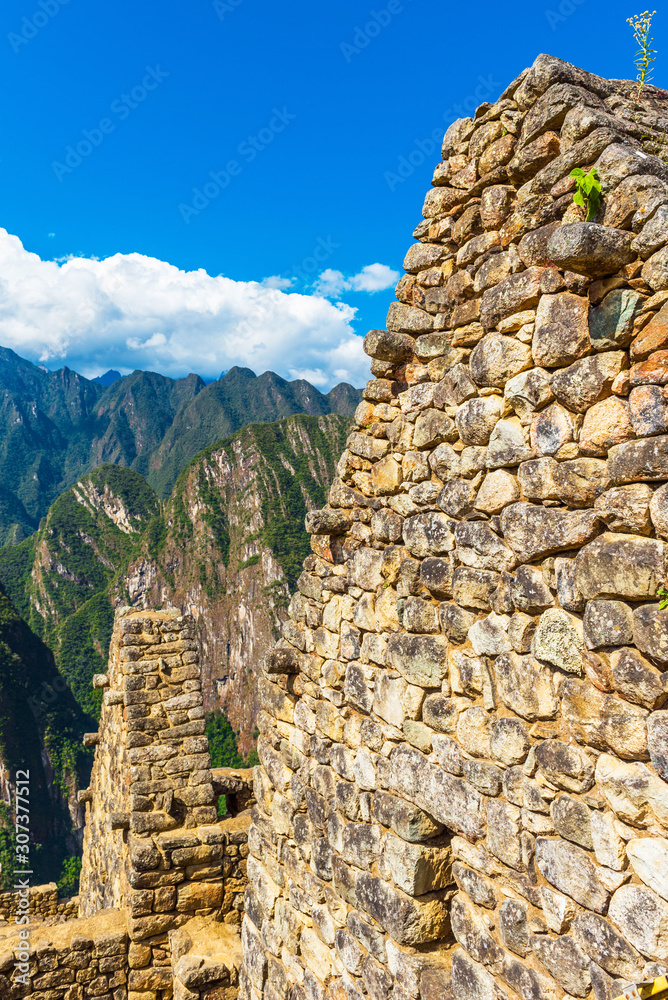 Fototapeta premium View of the walls of the ancient city of Machu Picchu, Peru. Vertical.