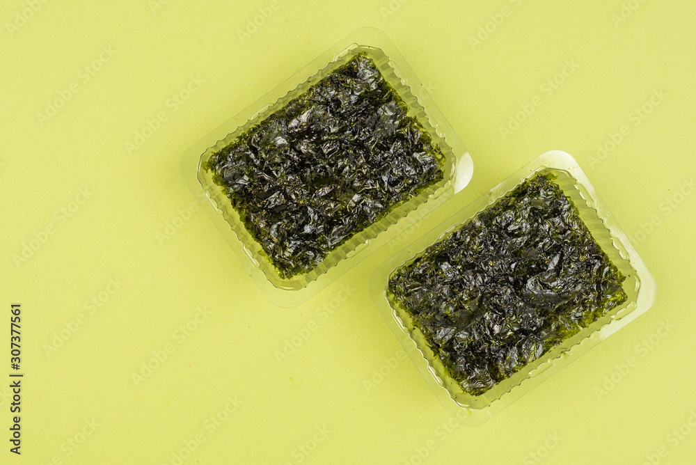 Nori seaweed on a green background. Nori seaweed on a green background.