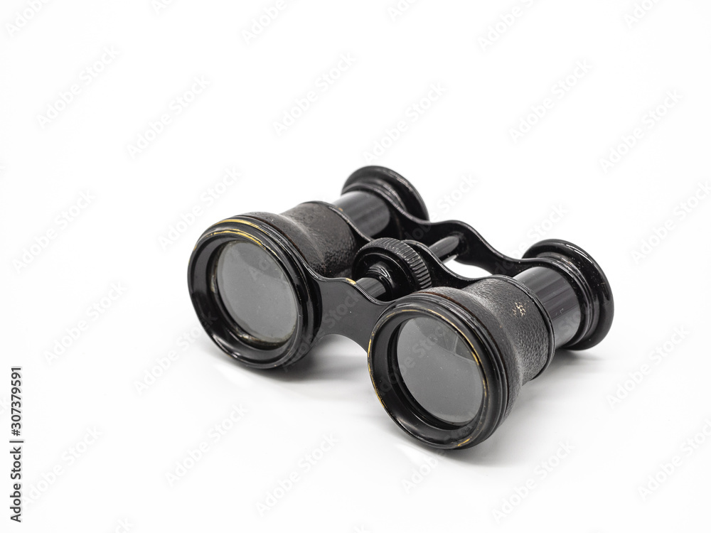 Antique opera glasses isolated on white background. Black small vintage binocular. Antique opera glasses isolated on white background. Black small vintage binocular.