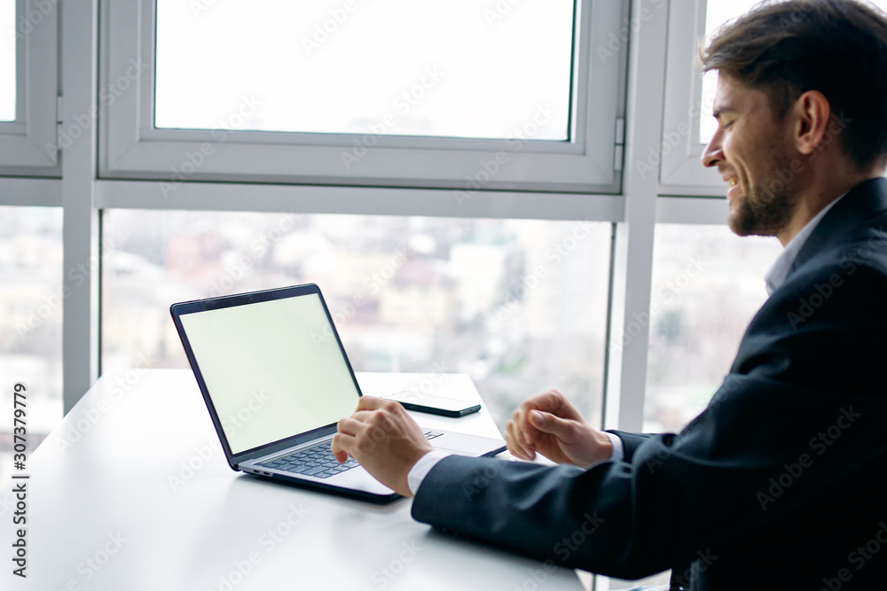 businessman working on laptop in office businessman working on laptop in office