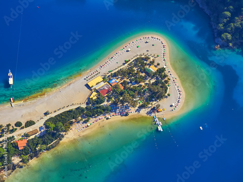 Fototapeta Naklejka Na Ścianę i Meble -  Amazing aerial view of Blue Lagoon in Oludeniz, Turkey. Summer landscape with sea spit, green trees, azure water, sandy beach in bright sunny day.